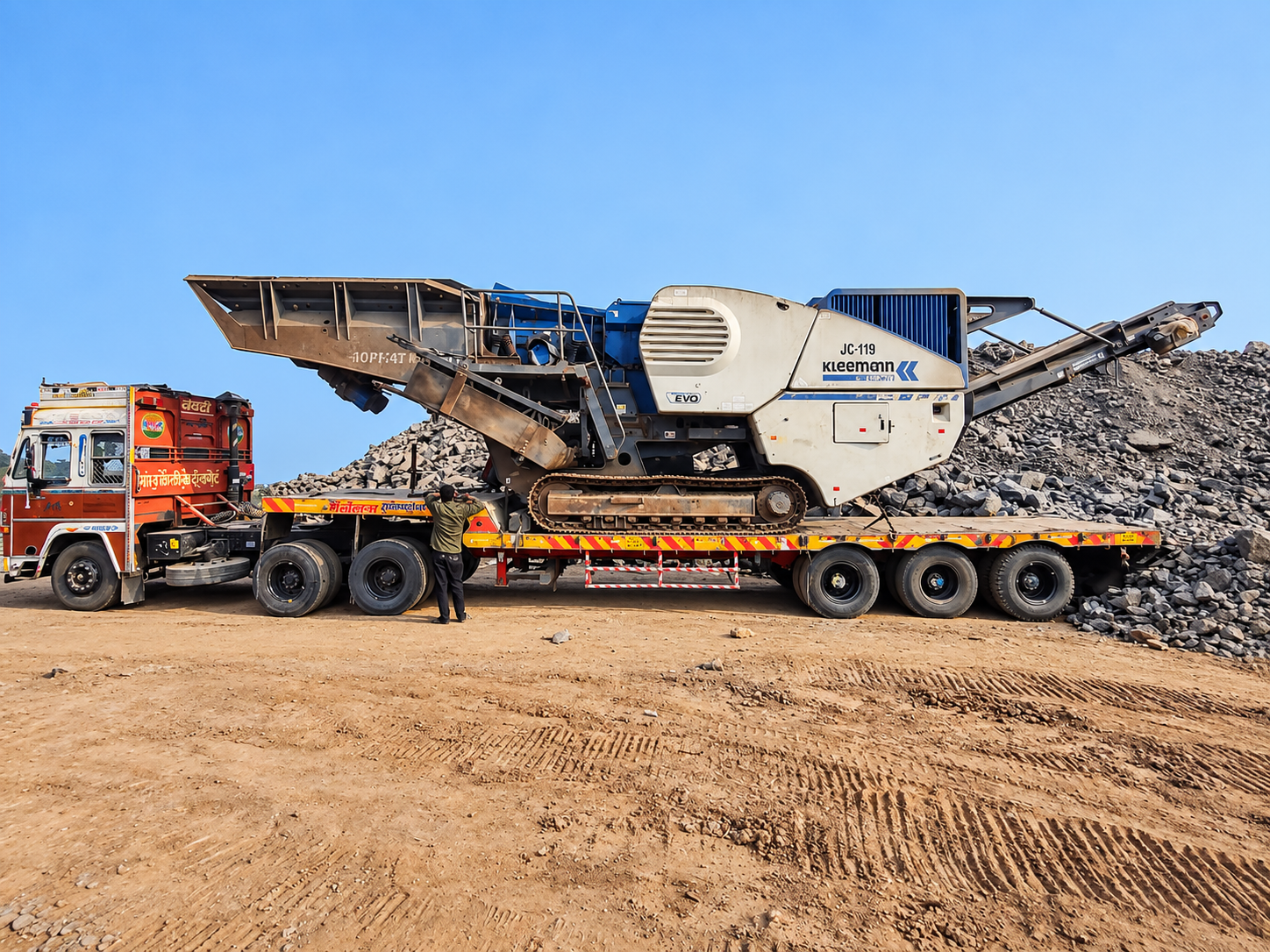 A 40 FT flatbed trailer with its tractor head